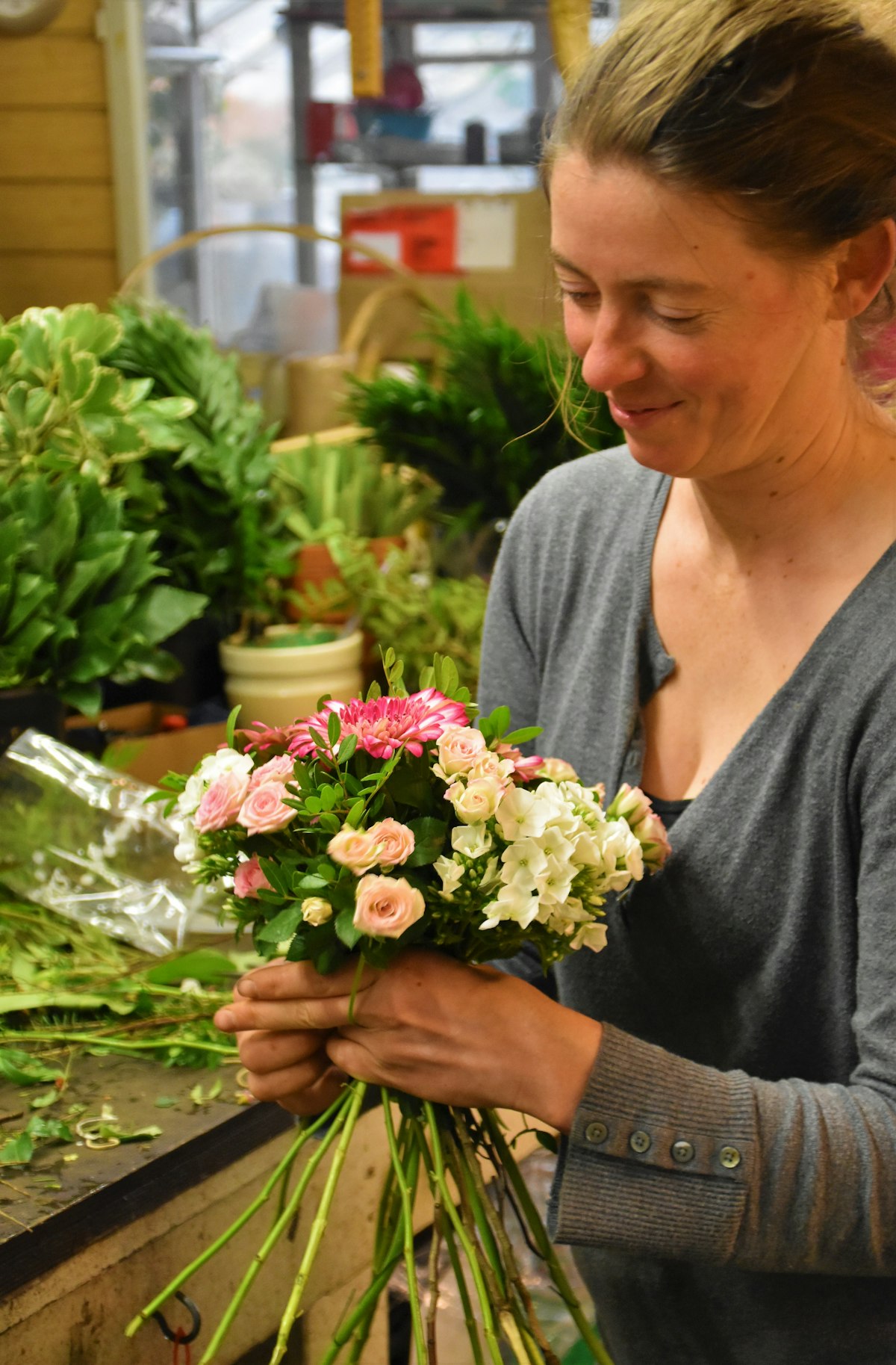 A florist working in her flower shop